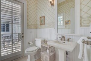 Gables by the Sea- Outdoor half bath with entrance from the private pool
